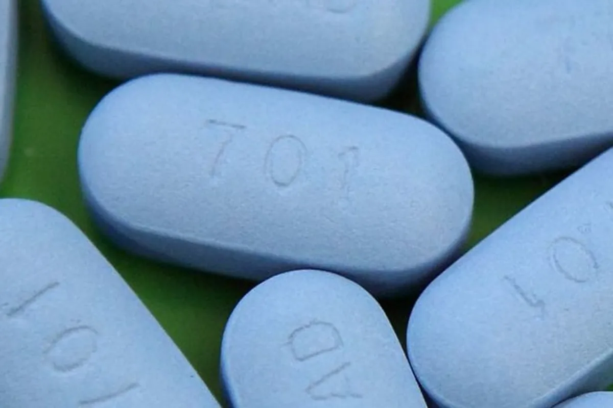 Close-up of blue oval PrEP tablets