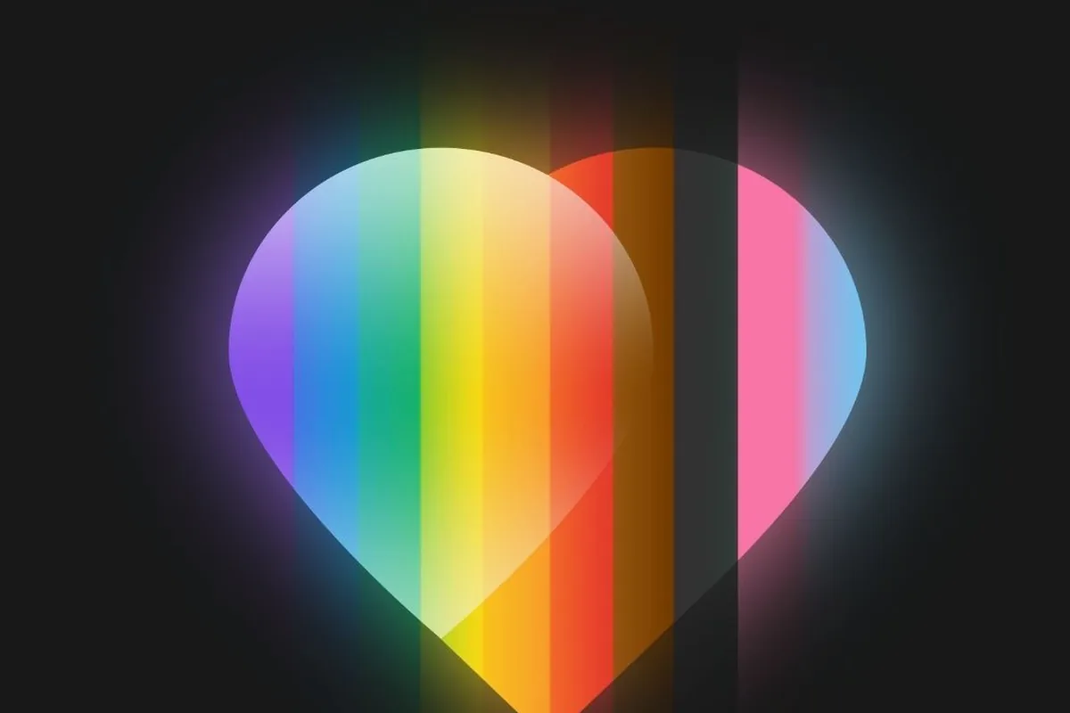 A glowing rainbow heart on a black background