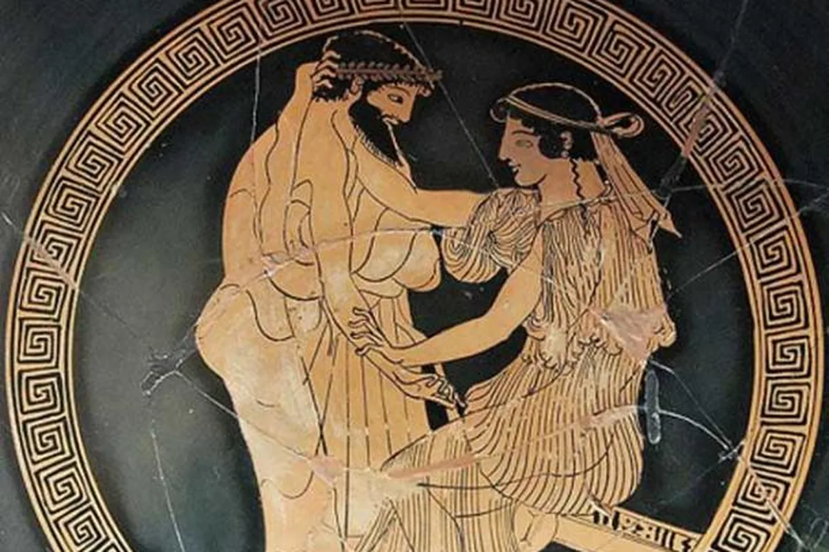 An ancient Greek red-figure cup painting of a clothed man and woman